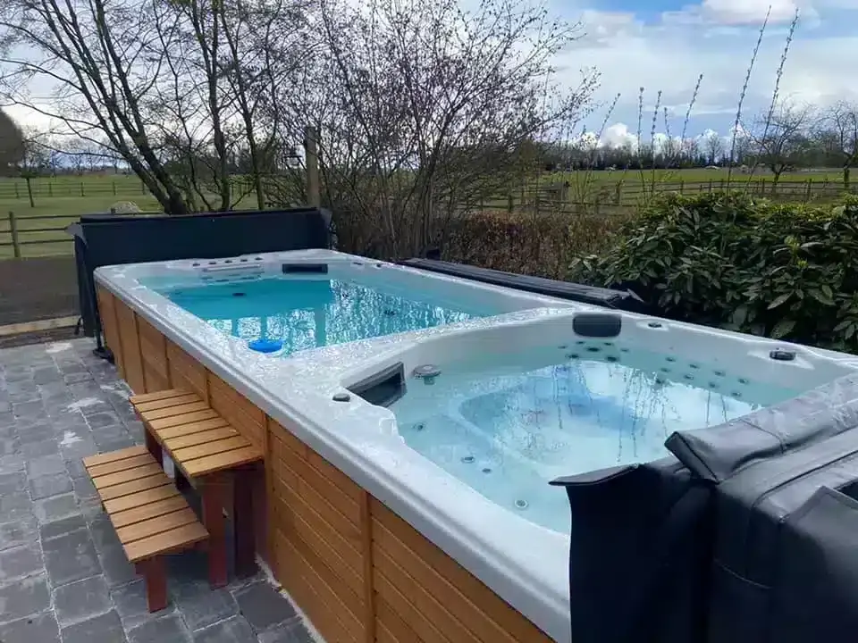 Swim spa with swim zone and seating area