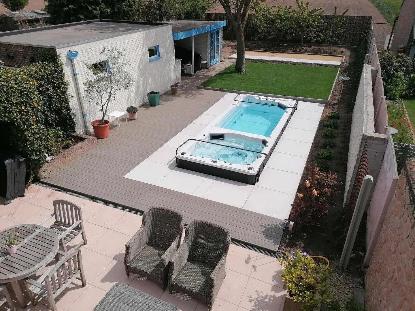 Swim spa with counter-current in a garden